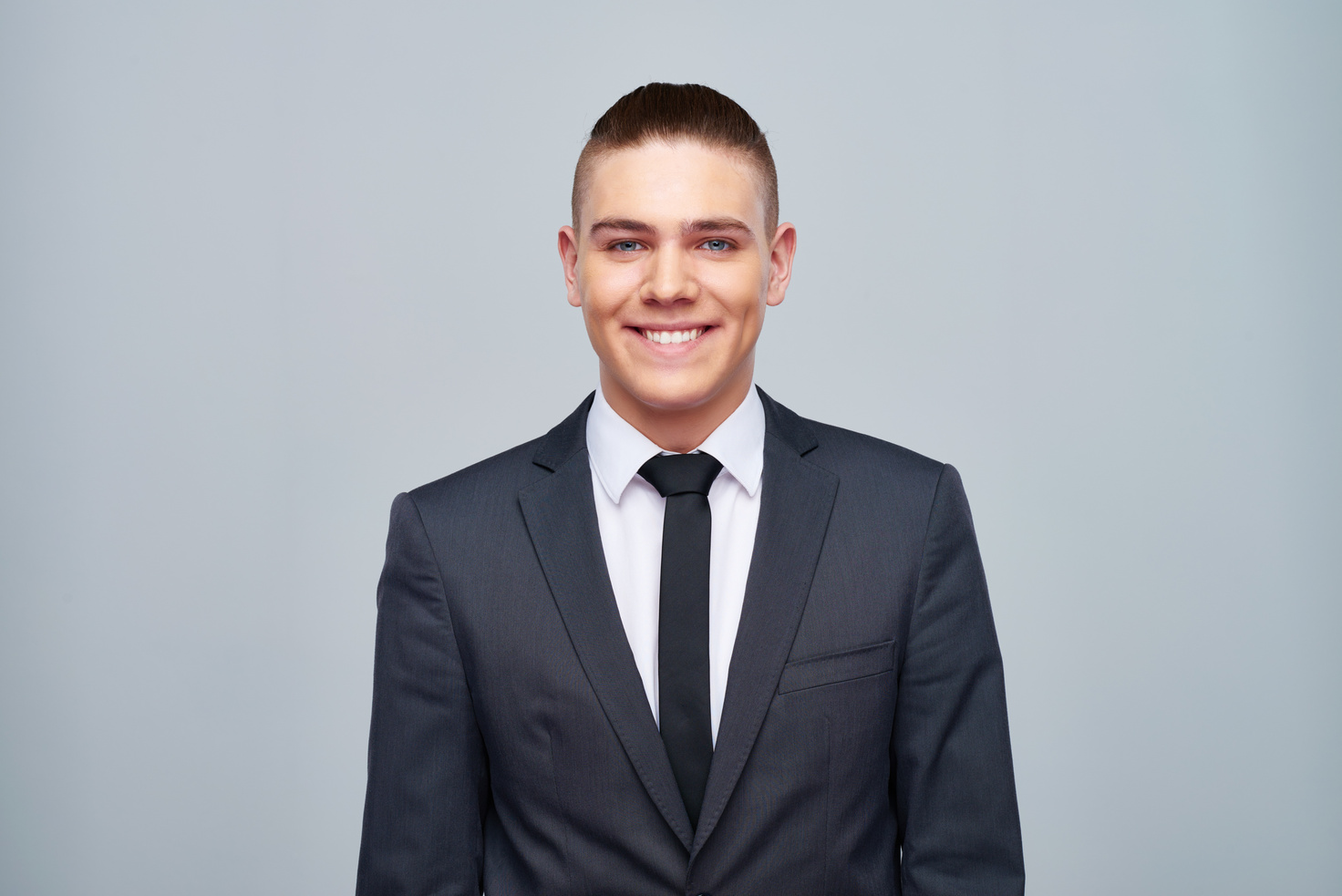 Smiling young man in formal suit